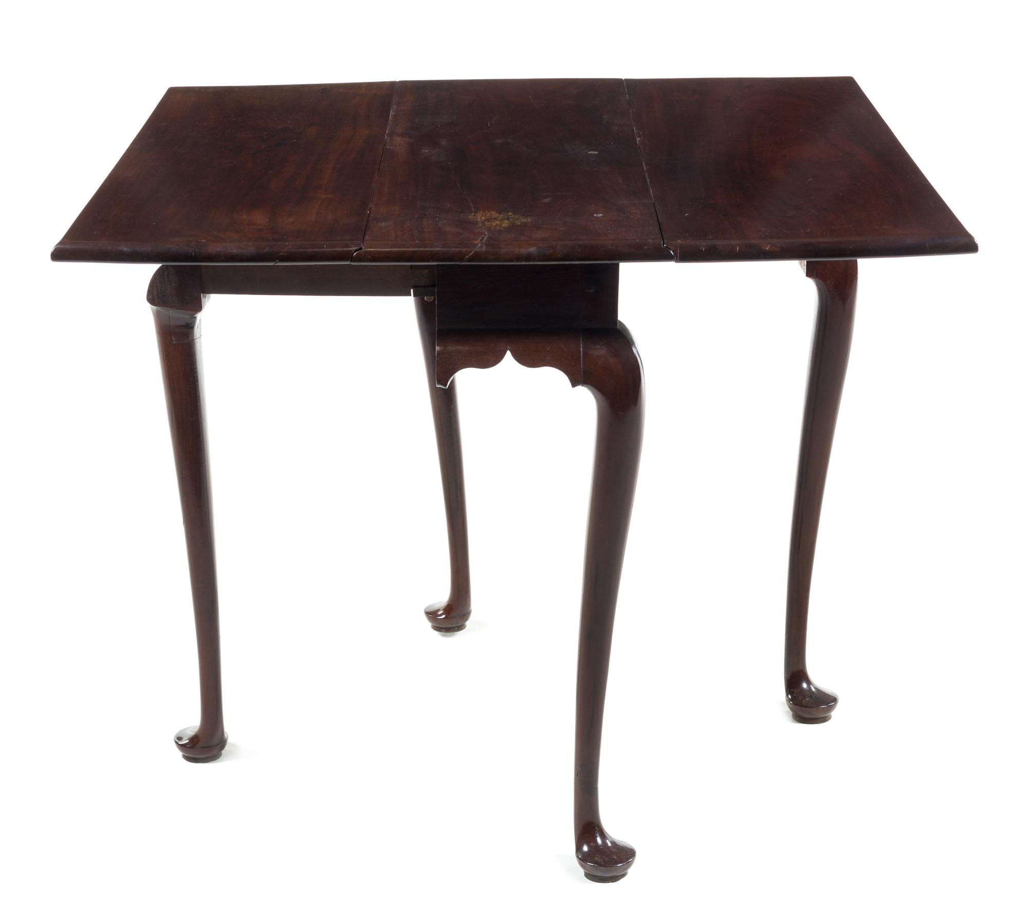 A Queen Anne Walnut Drop-Leaf Table Height 27 1/2 x width 12 (closed) x depth 31 1/4 inches. — 18TH CENTURY