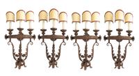 A Set of Four Gilt and Patinated Metal Three-Light Sconces Height 19 inches. — STYLE OF ADDISON MIZNER, EARLY 20TH CENTURY