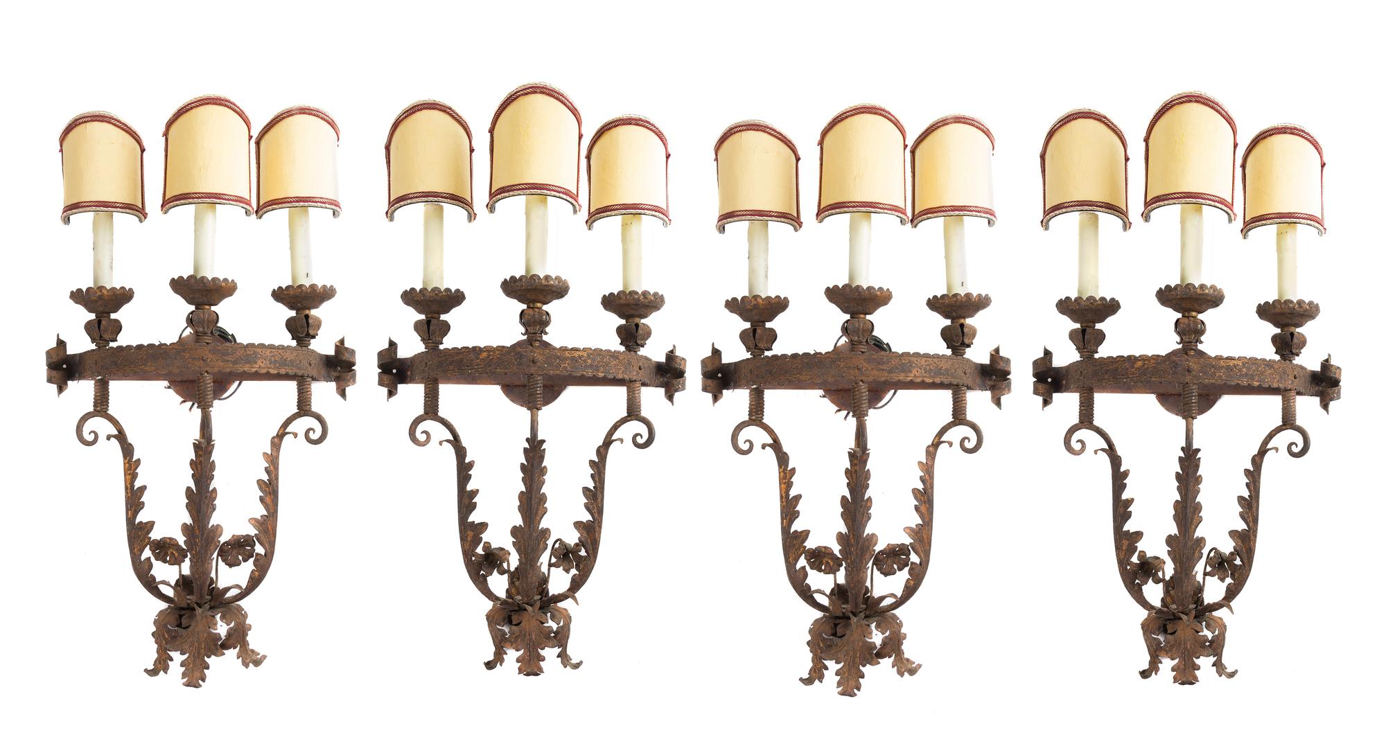 A Set of Four Gilt and Patinated Metal Three-Light Sconces Height 19 inches. — STYLE OF ADDISON MIZNER, EARLY 20TH CENTURY