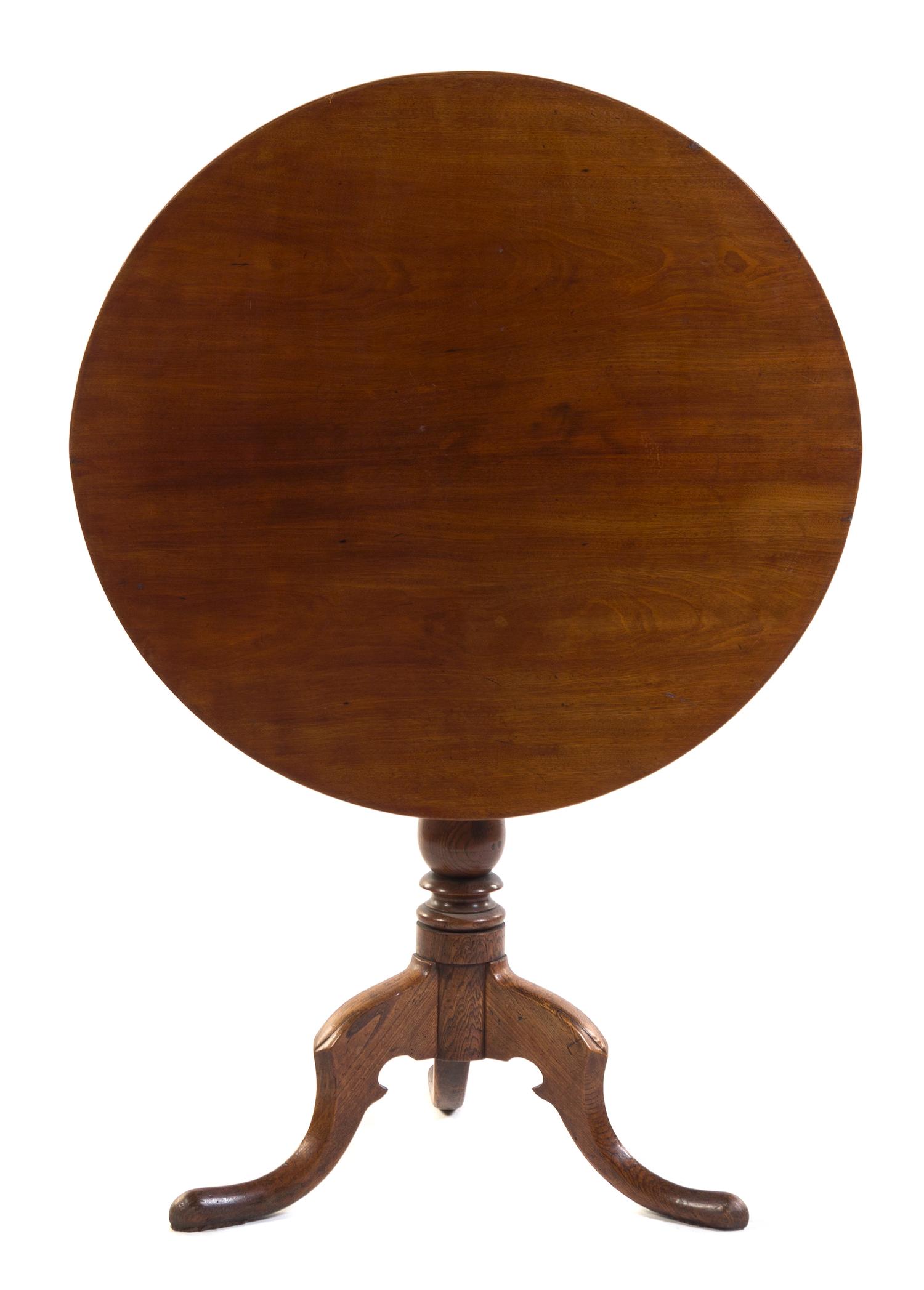 An English Mahogany and Elm Tilt-Top Tea Table Height 29 1/4 inches.