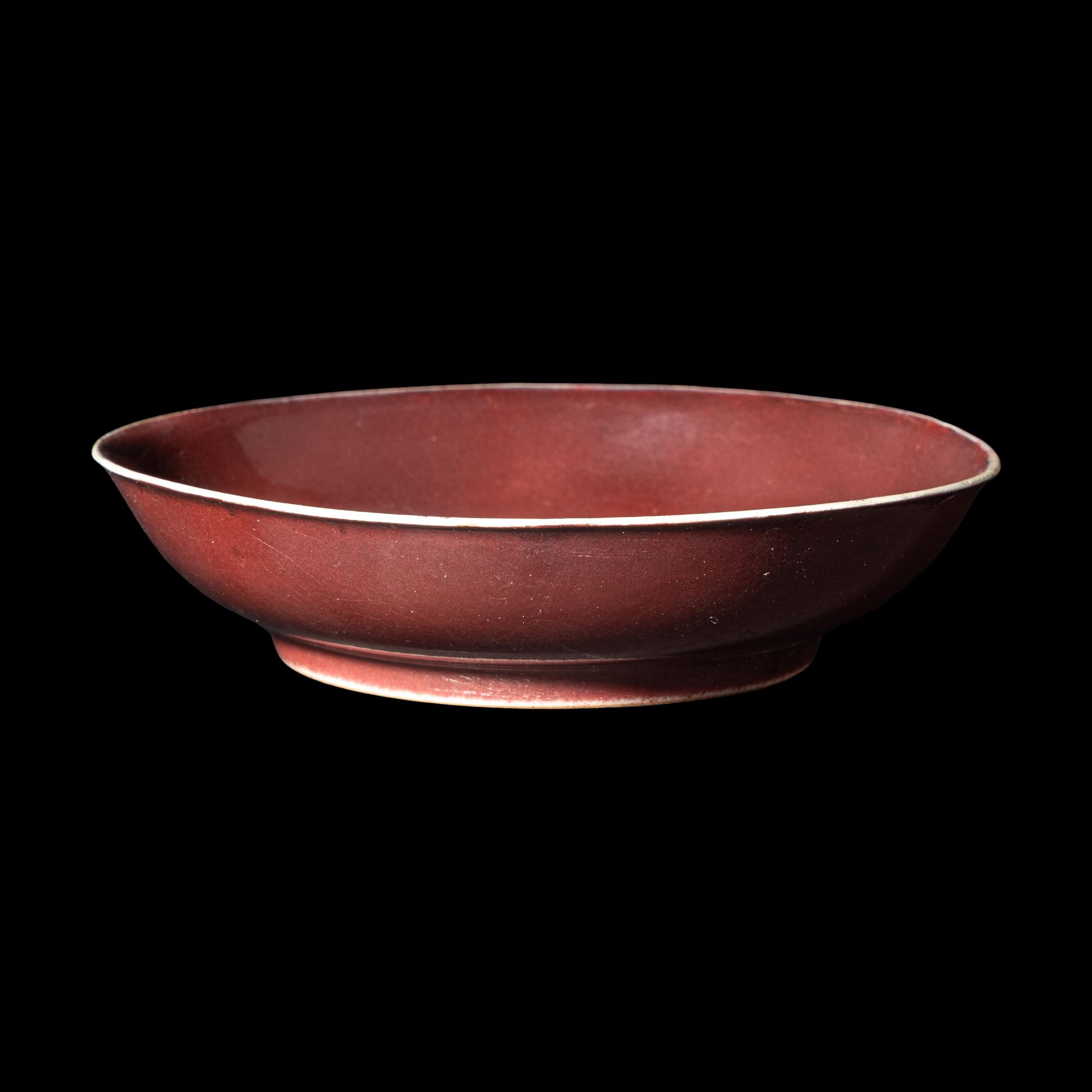 A Chinese Copper Red Glazed Porcelain Plate, Possibly Qianlong Period 或爲清乾隆 寶石紅釉盤
