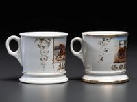 Two Porcelain Occupational Shaving Mugs with Horse-Drawn Delivery Wagons