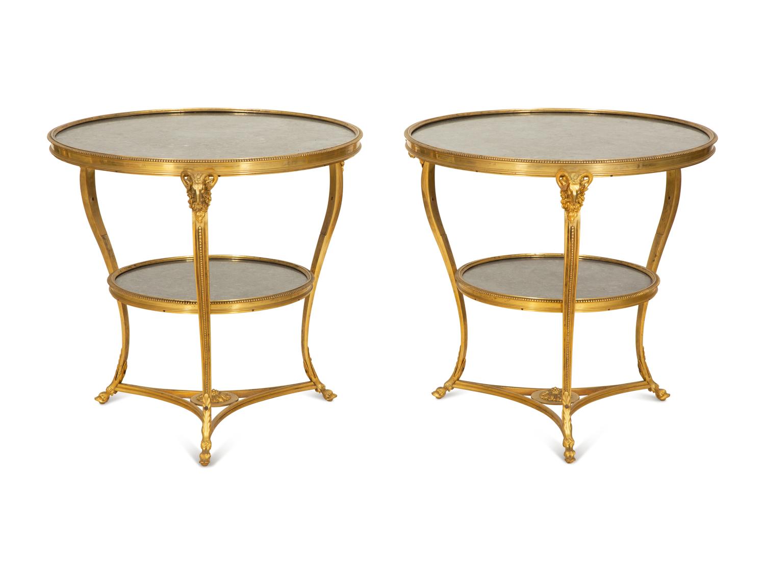 A Pair of French Empire Style Gilt Bronze and Black Marble Two Tier Gueridon Tables