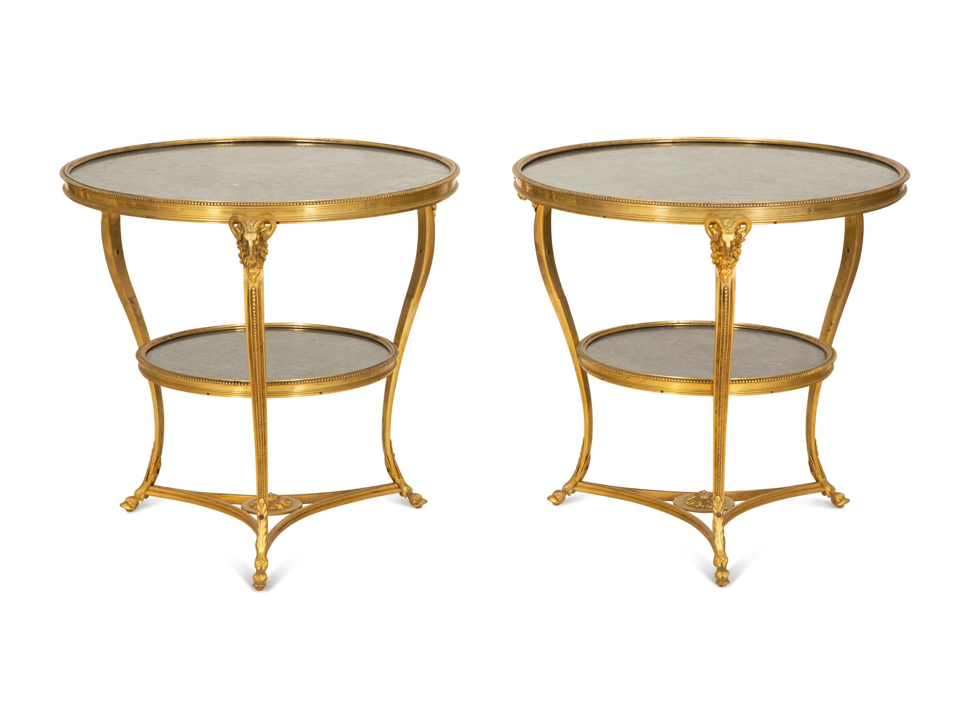 A Pair of French Empire Style Gilt Bronze and Black Marble Two Tier Gueridon Tables