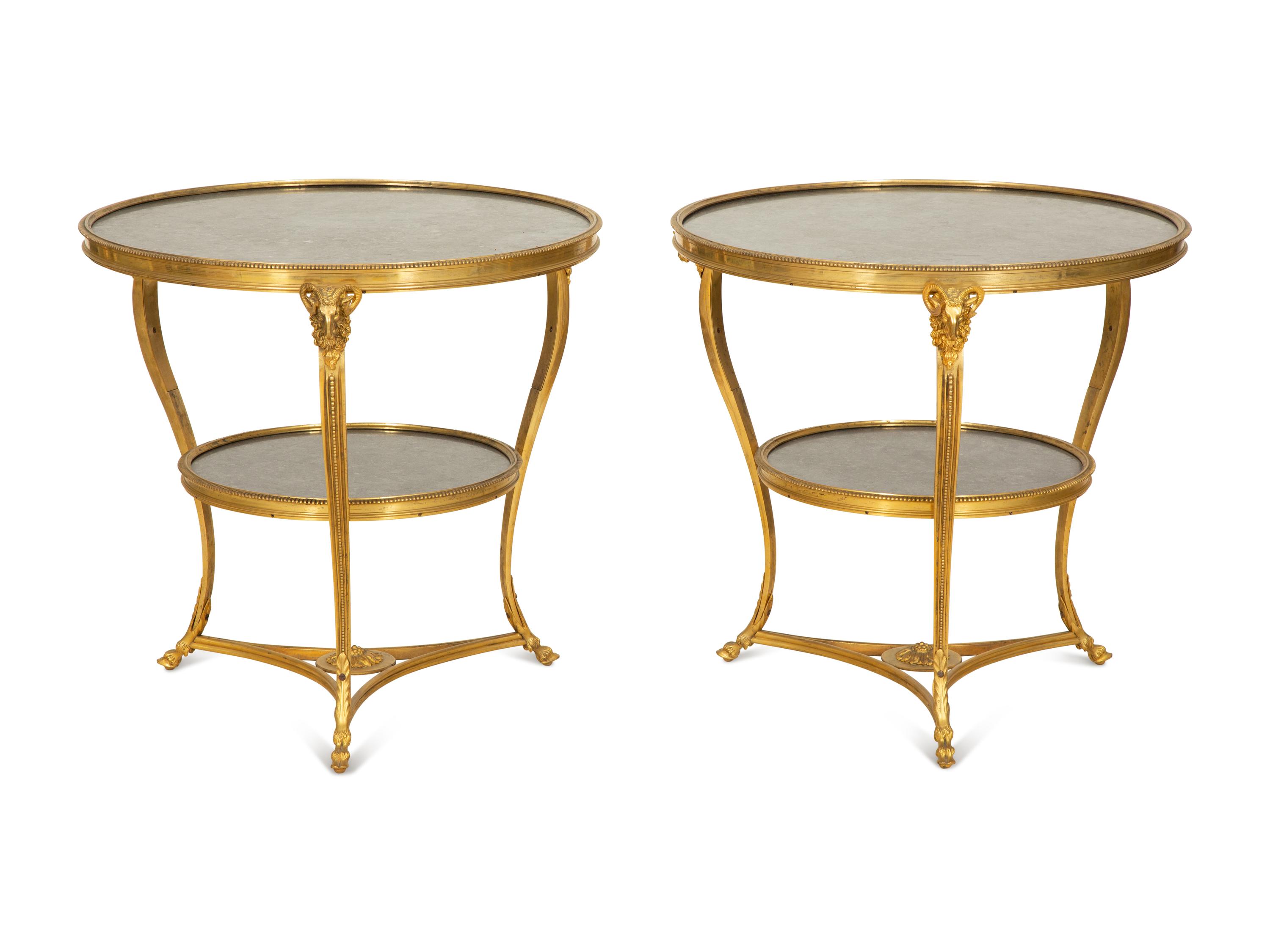 A Pair of French Empire Style Gilt Bronze and Black Marble Two Tier Gueridon Tables