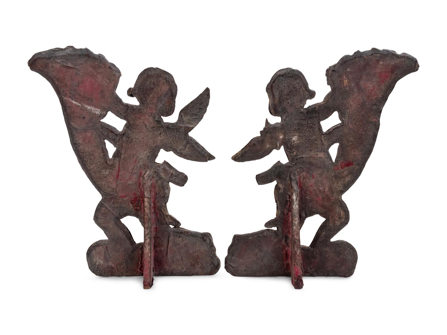 A Pair of Silver Clad Figures of Angels