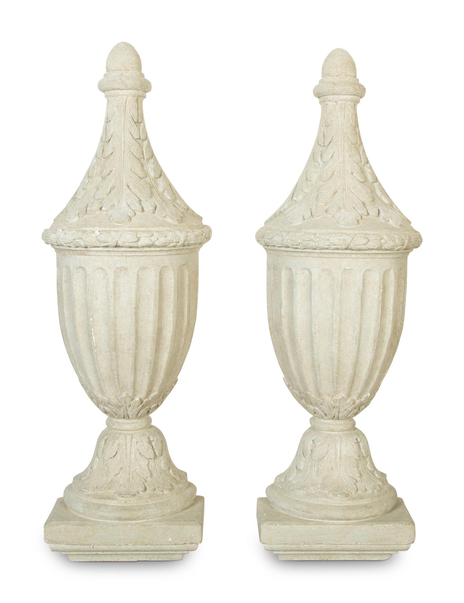 A Pair of Painted Composition Wall Appliqués