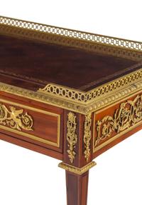 A Louis XVI Style Gilt Bronze Mounted Mahogany Table à Écrire