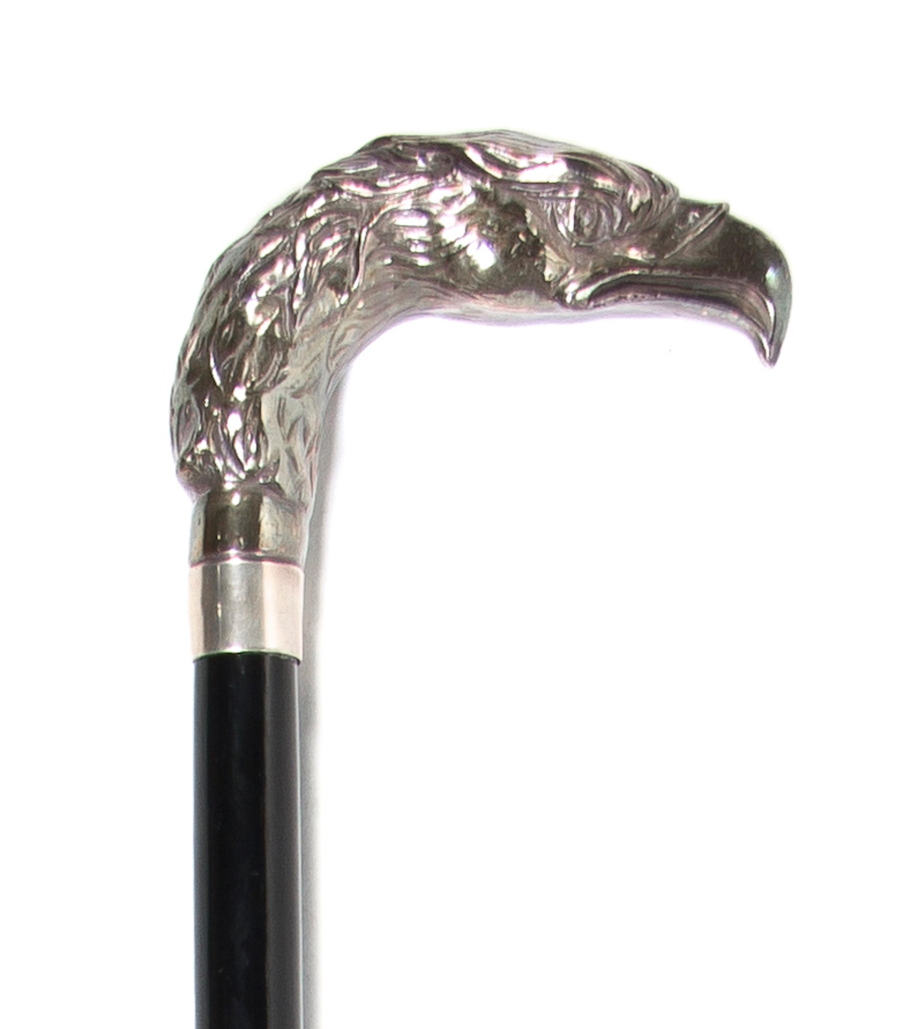 A Sterling Silver Cane Handle, Height overall 36 3/4 x width of handle 4 1/8 inches.