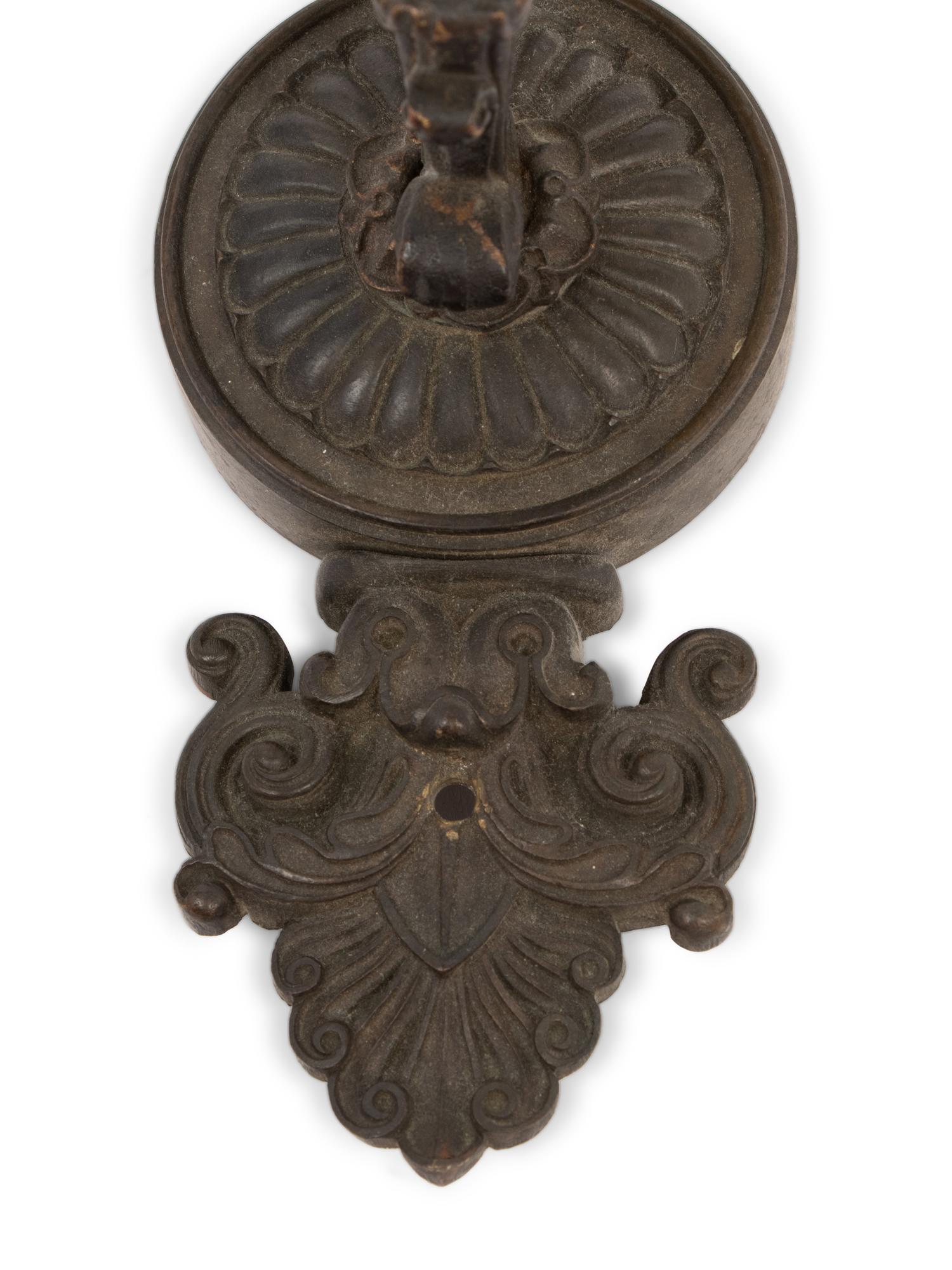 A Pair of Neoclassical Patinated Metal Three-Light Wall Sconces