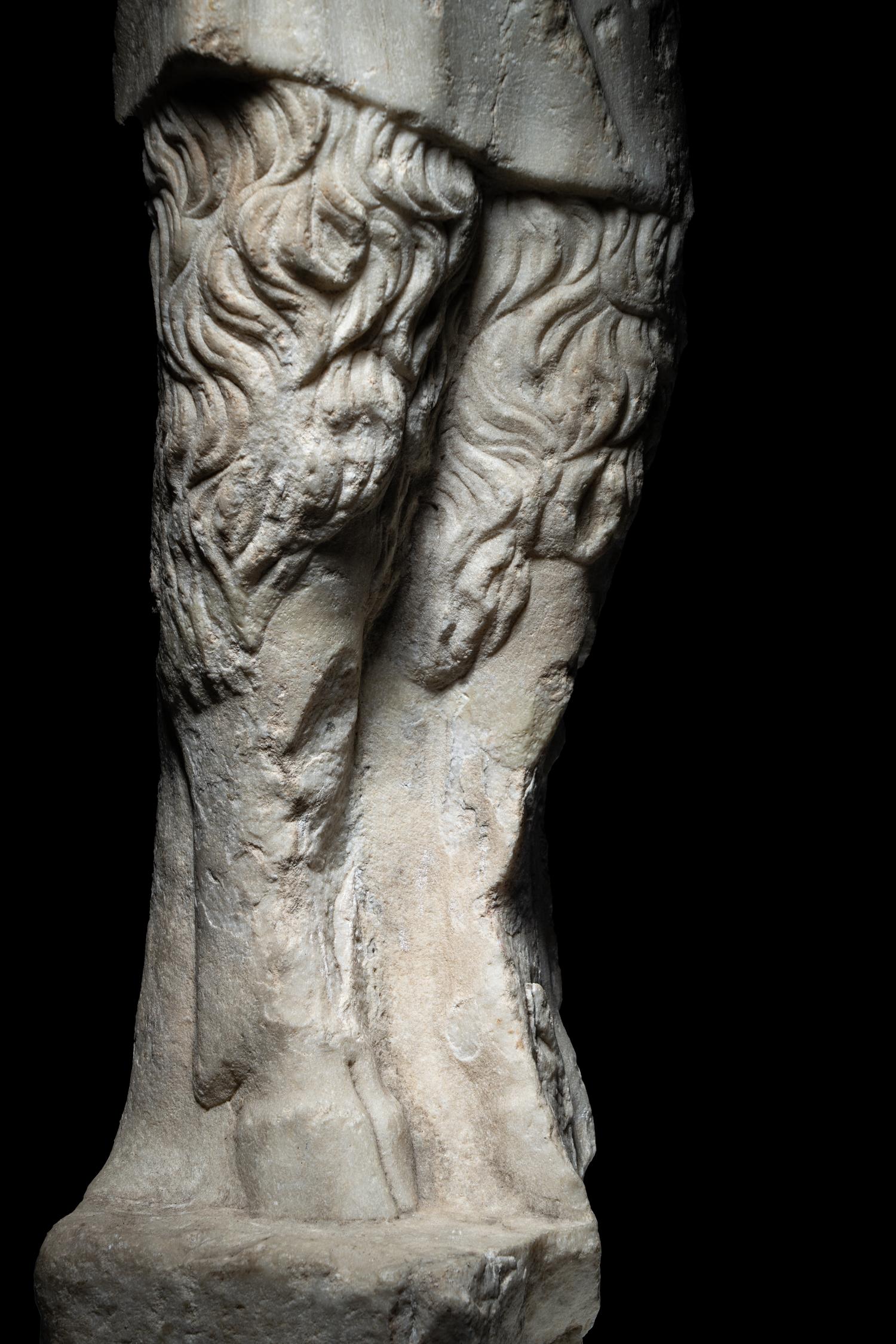 A Roman Marble Statue of Pan Holding Pipes