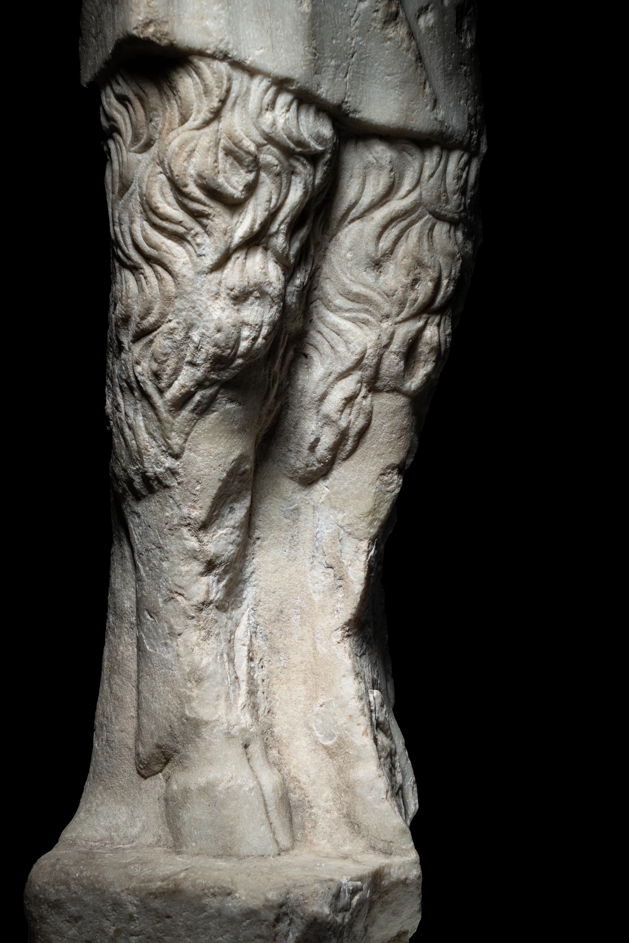 A Roman Marble Statue of Pan Holding Pipes