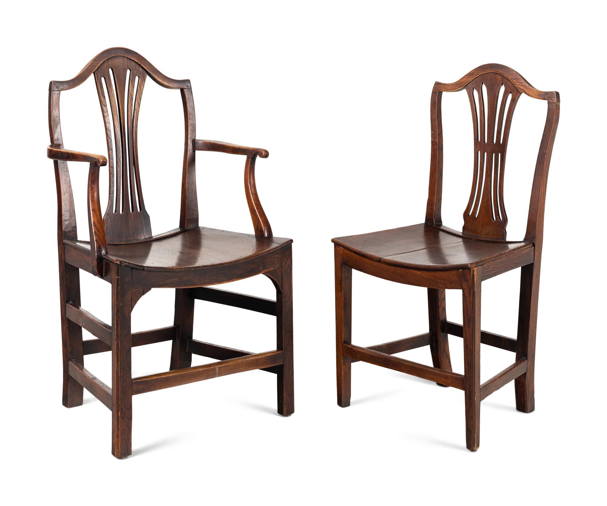 A Set of Six English Carved Oak Dining Chairs