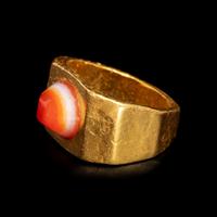 A Roman Gold and Banded Carnelian Cabochon Finger Ring