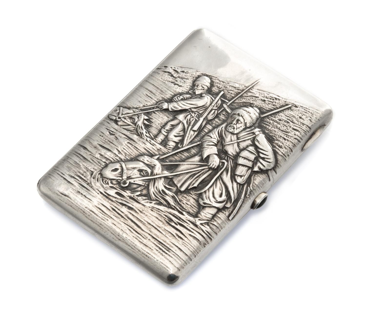 A Russian Silver Cigarette Case, Mark of S. Storganov, Moscow, 19th century, the lid with raised decoration showing two men standing on