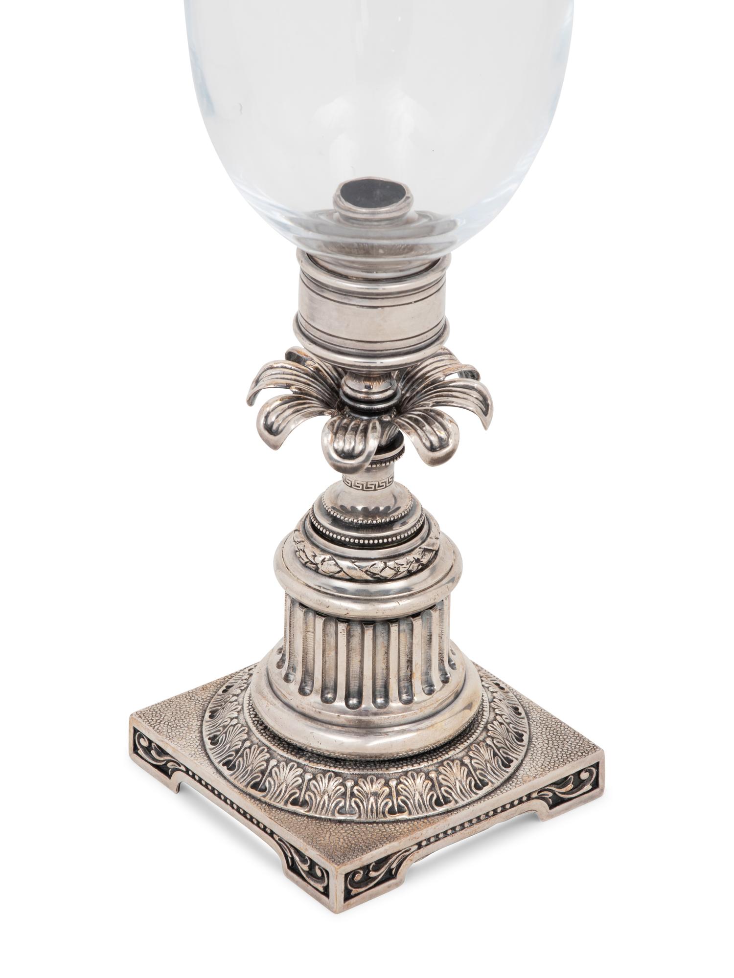 A Pair of Silvered-Metal and Glass Hurricane Candlesticks