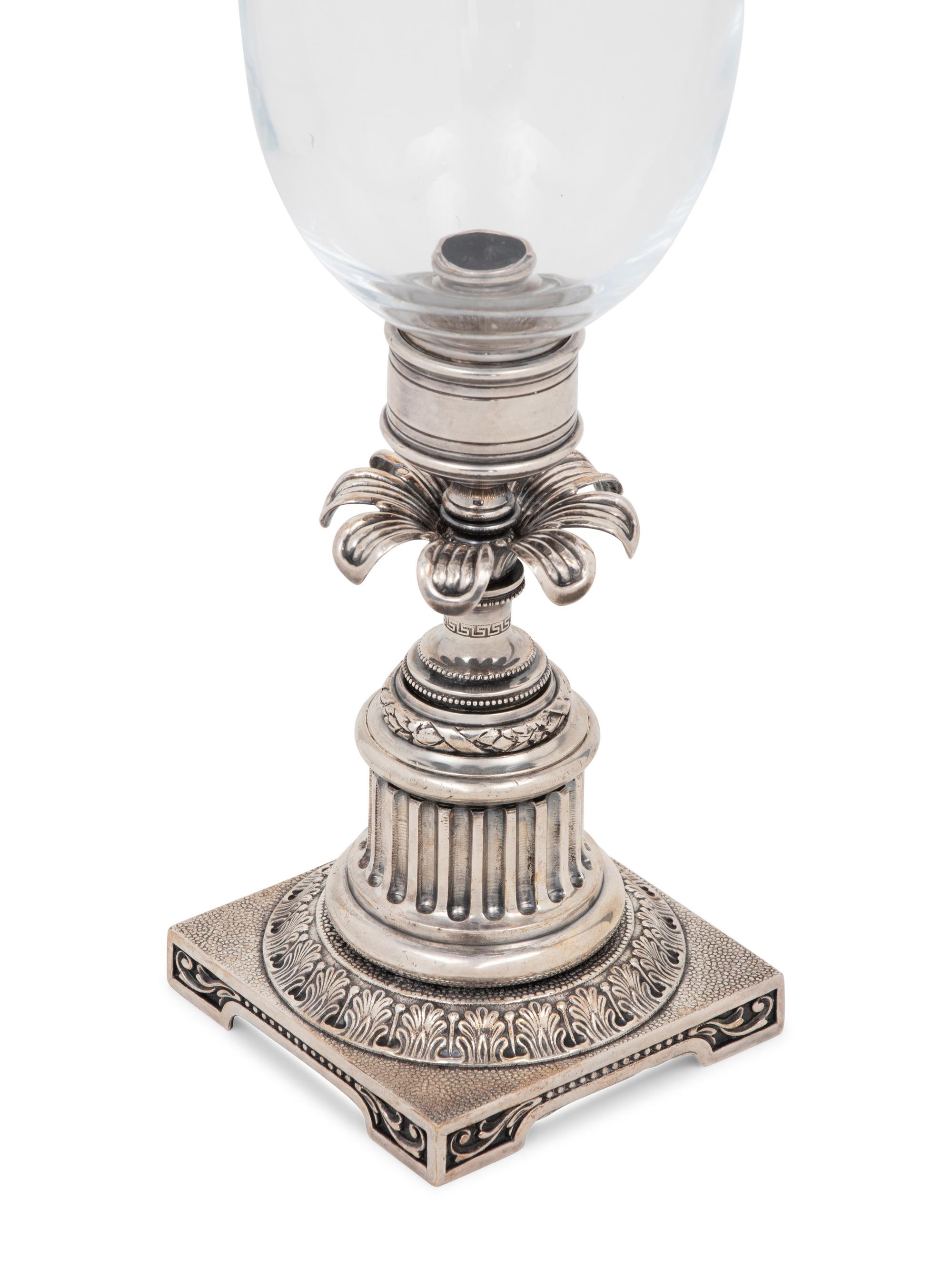 A Pair of Silvered-Metal and Glass Hurricane Candlesticks