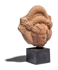 An Egyptian Terracotta Head of a Goddess
