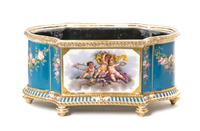 A Sevres Style Porcelain Jardiniere, Height 9 x width 18 inches.