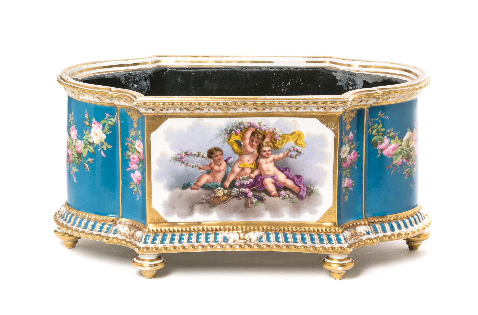 A Sevres Style Porcelain Jardiniere, Height 9 x width 18 inches.