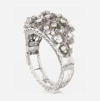 A white gold and diamond bangle