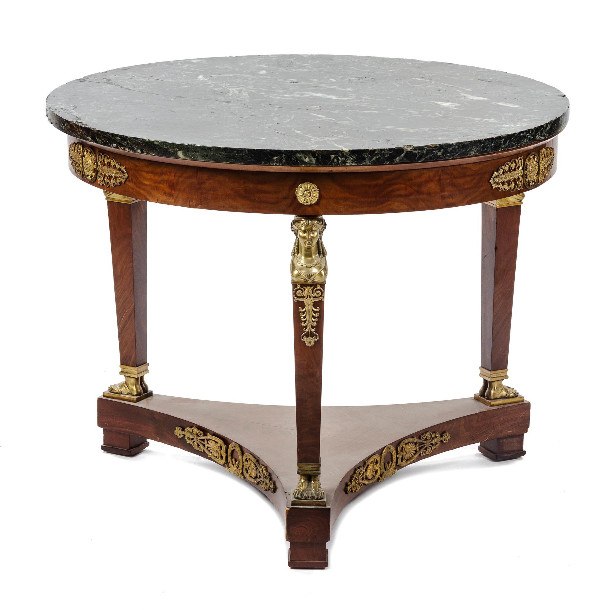 An Empire Style Gilt Bronze Mounted Walnut Gueridon Height 28 x diameter 35 1/2 inches.