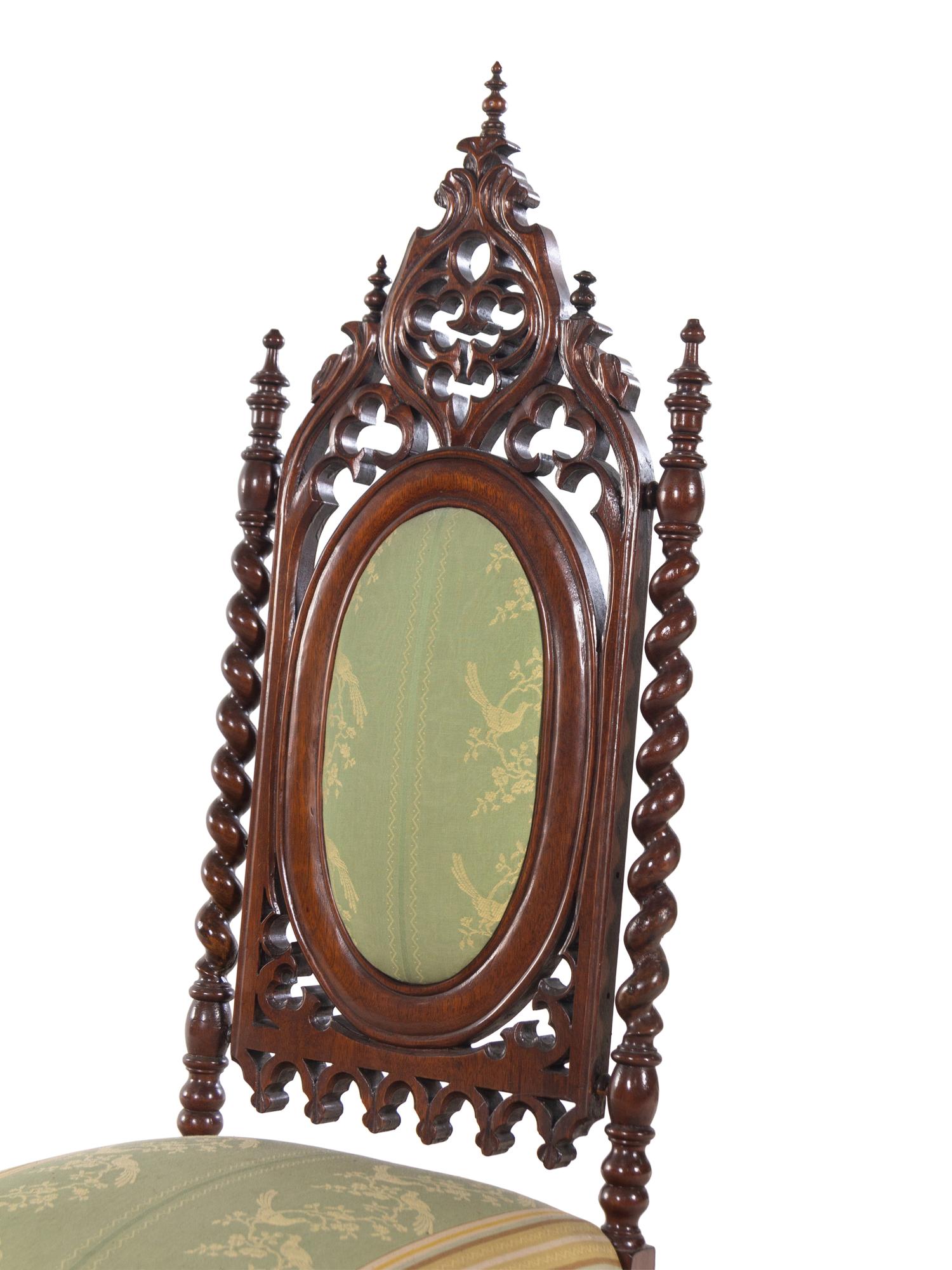 A Pair of Gothic Revival Carved Walnut Side Chairs