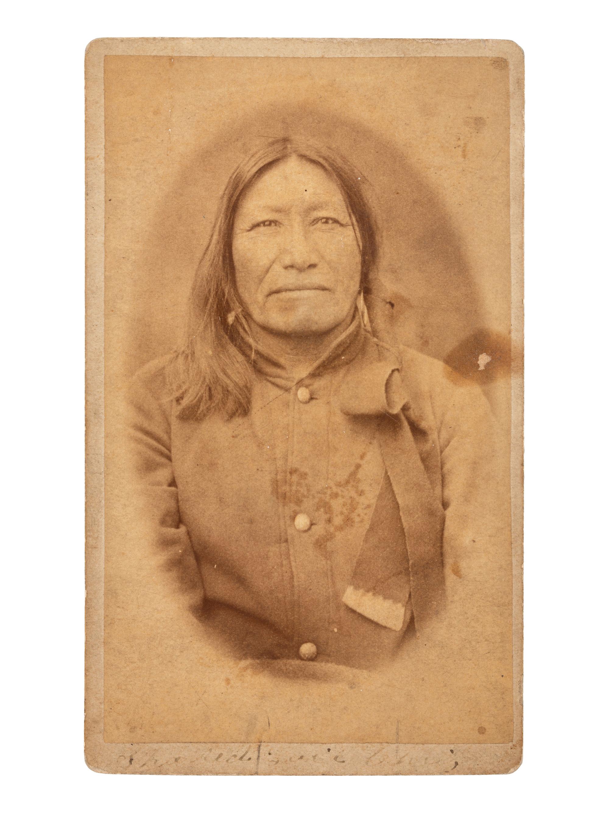 [NATIVE AMERICANS]. CROSS, William R., photographer. A group of 2 CDVs of Sioux subjects including Sitting Bull's prisoner of war camp. Niobrara, NE: n.d.