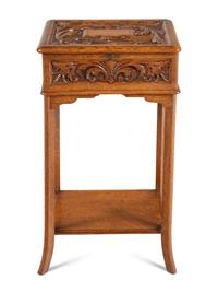 An English Carved Oak Lift Top Side Table