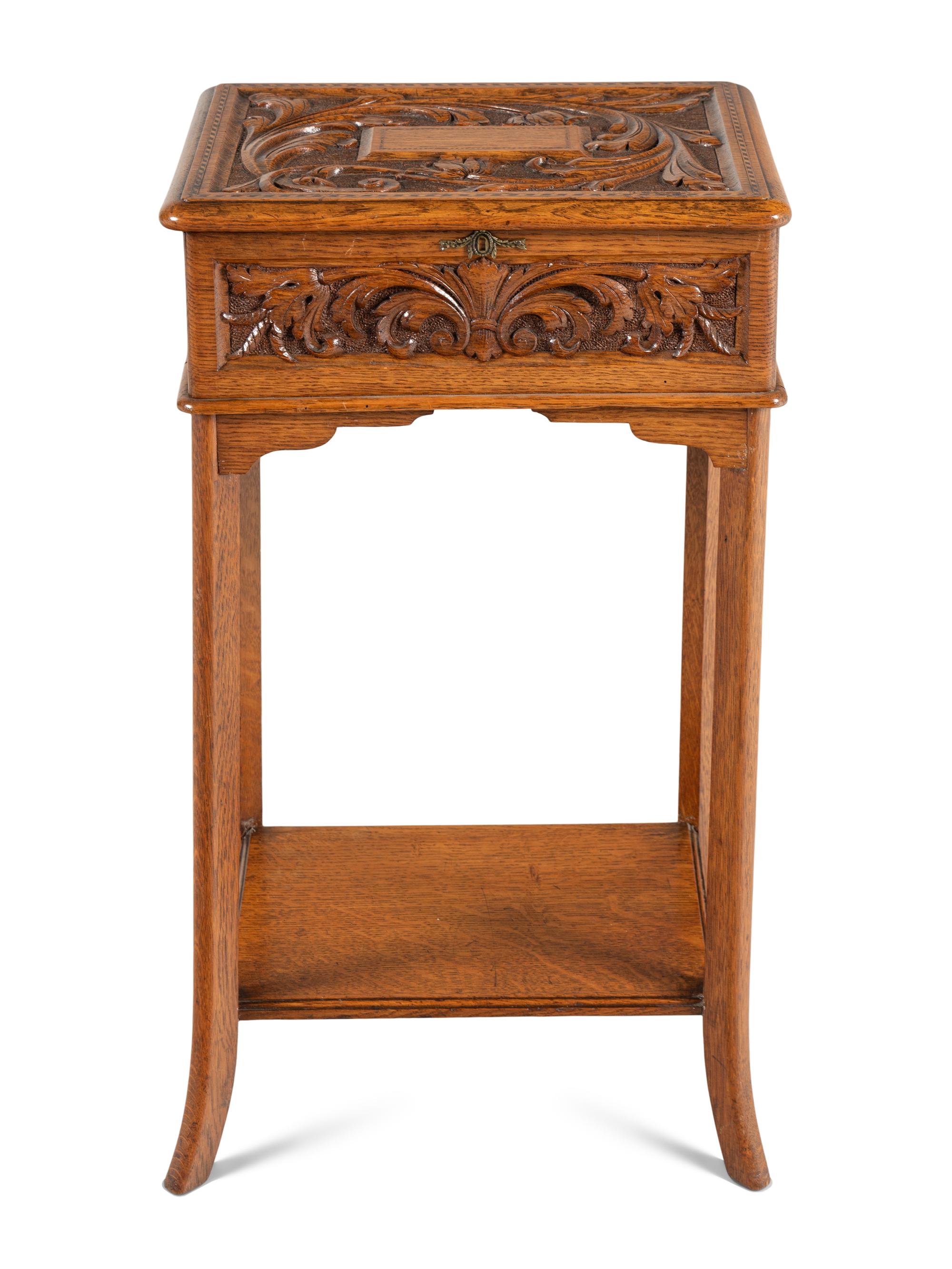 An English Carved Oak Lift Top Side Table