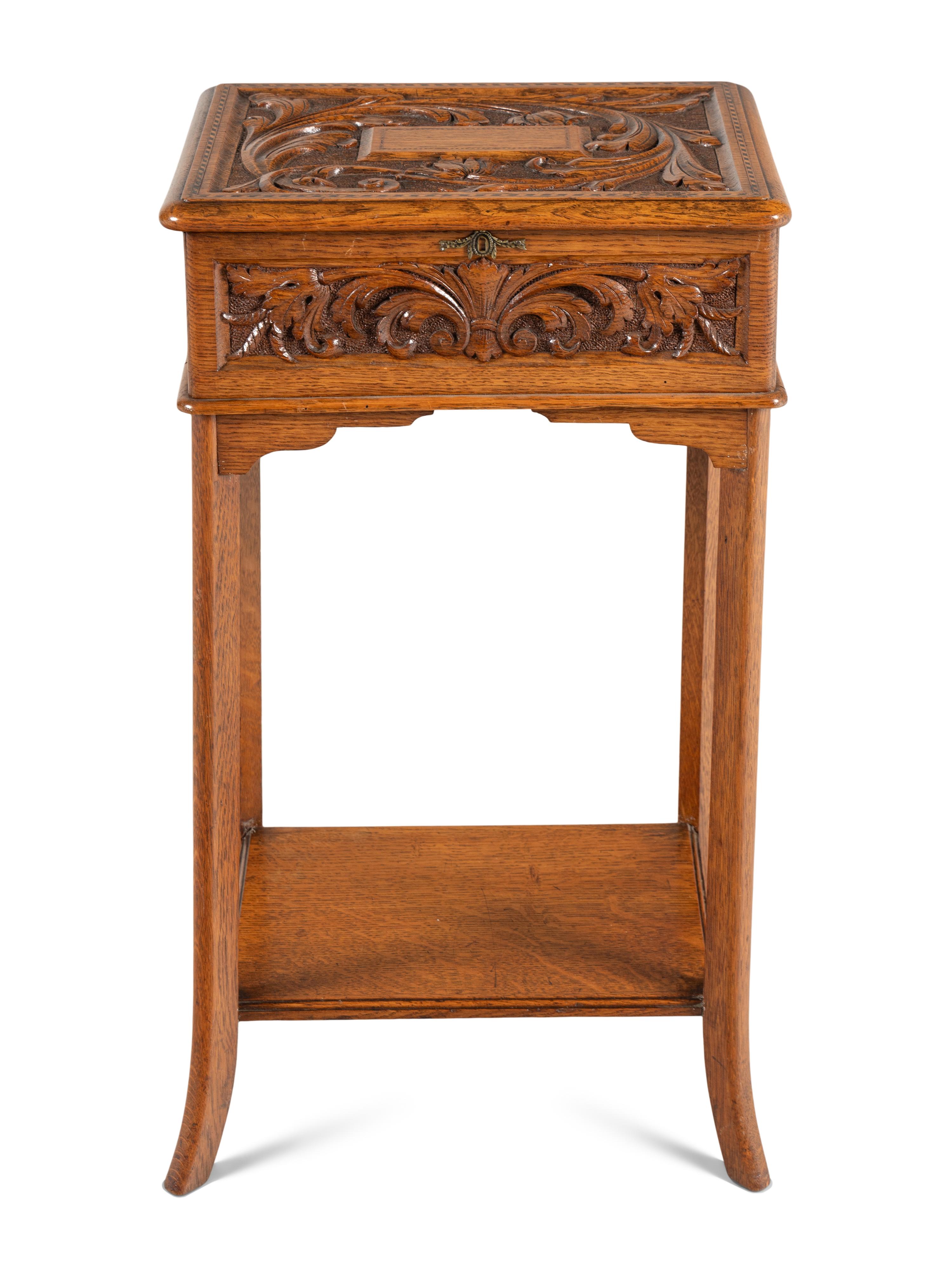 An English Carved Oak Lift Top Side Table