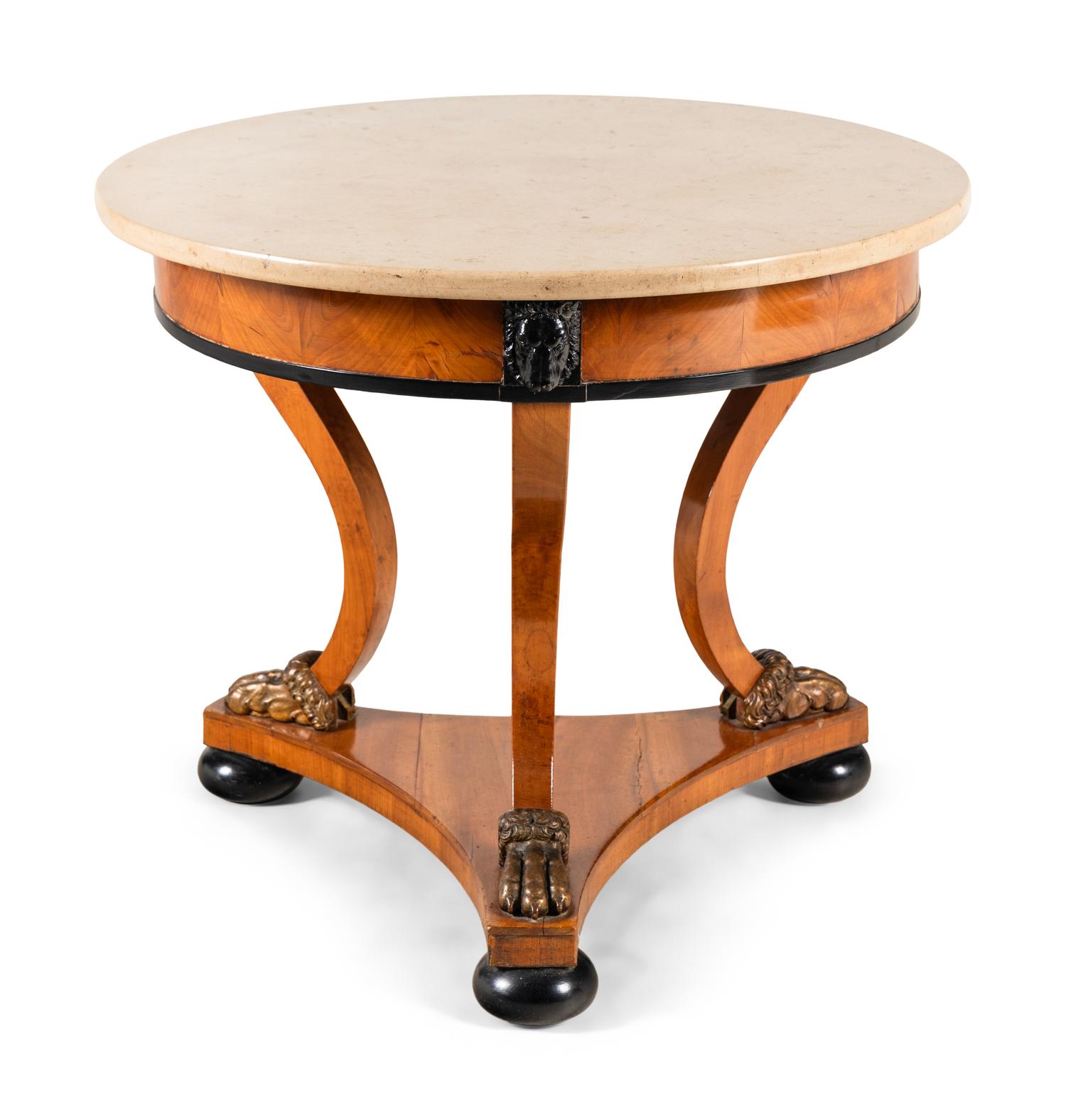A Continental Parcel Ebonized Birch Marble-Top Center Table