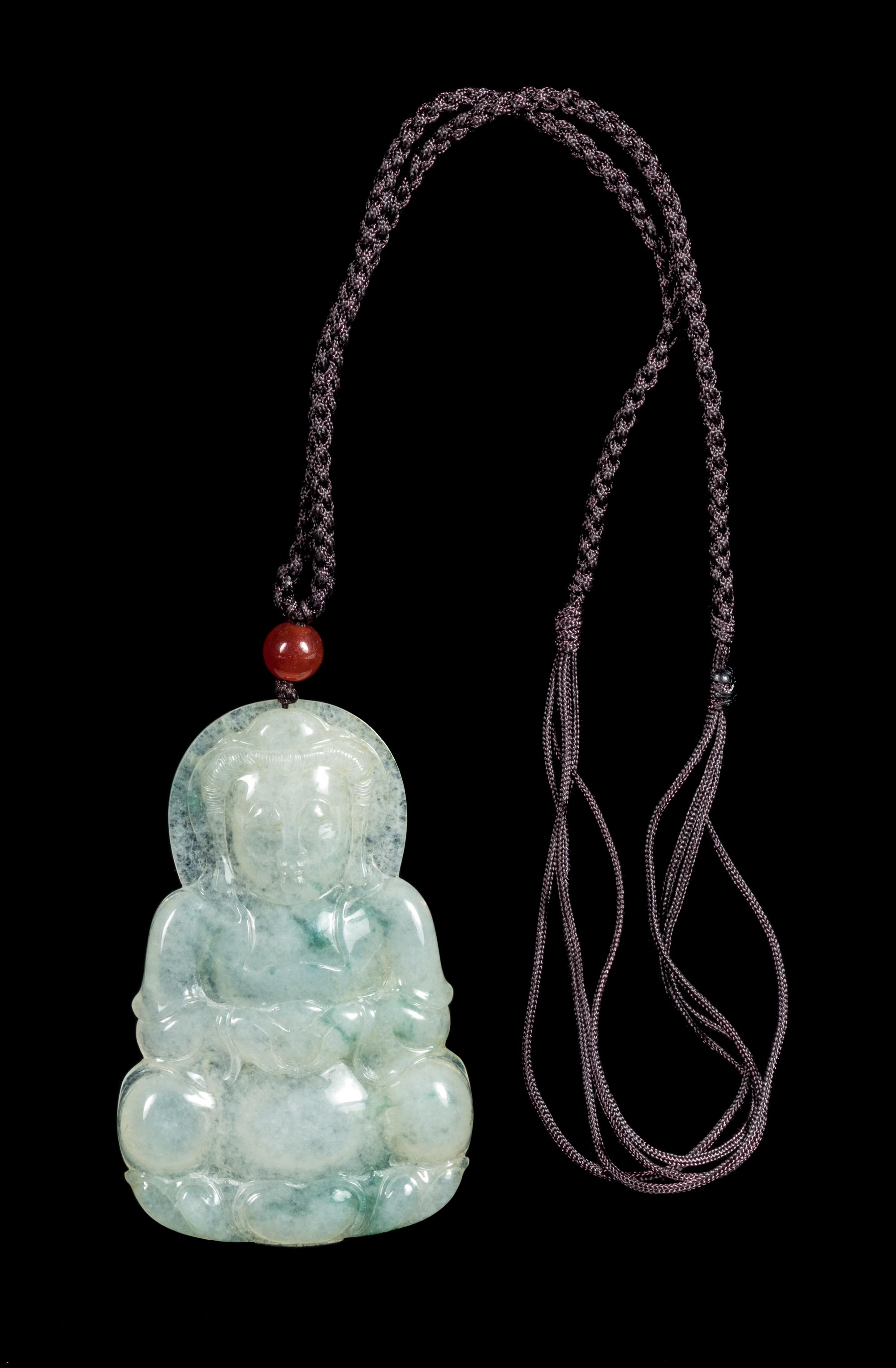 A Jadeite Buddha Pendant Length 2 3/4 inches. — 20TH CENTURY
