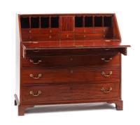 A George III Mahogany Slant-Front Desk Height 43 1/2 x width 47 1/2 x depth 22 inches. — EARLY 19TH CENTURY