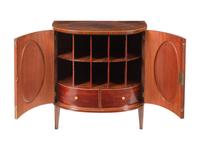 A Pair of George III Goncalo Alves Demilune Cabinets