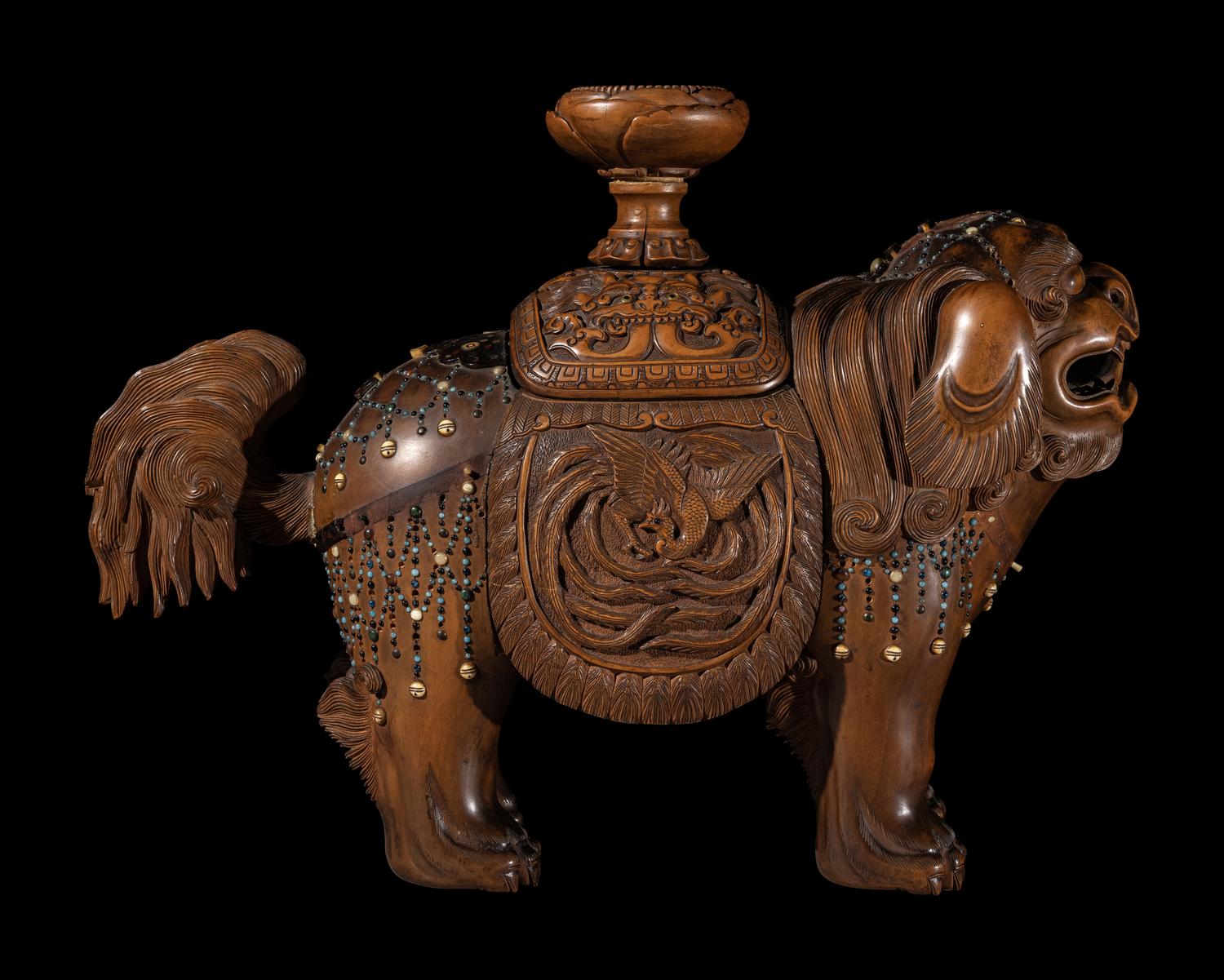 A Japanese Hardstone Inset Carved Boxwood Figure of an Shishi Lion