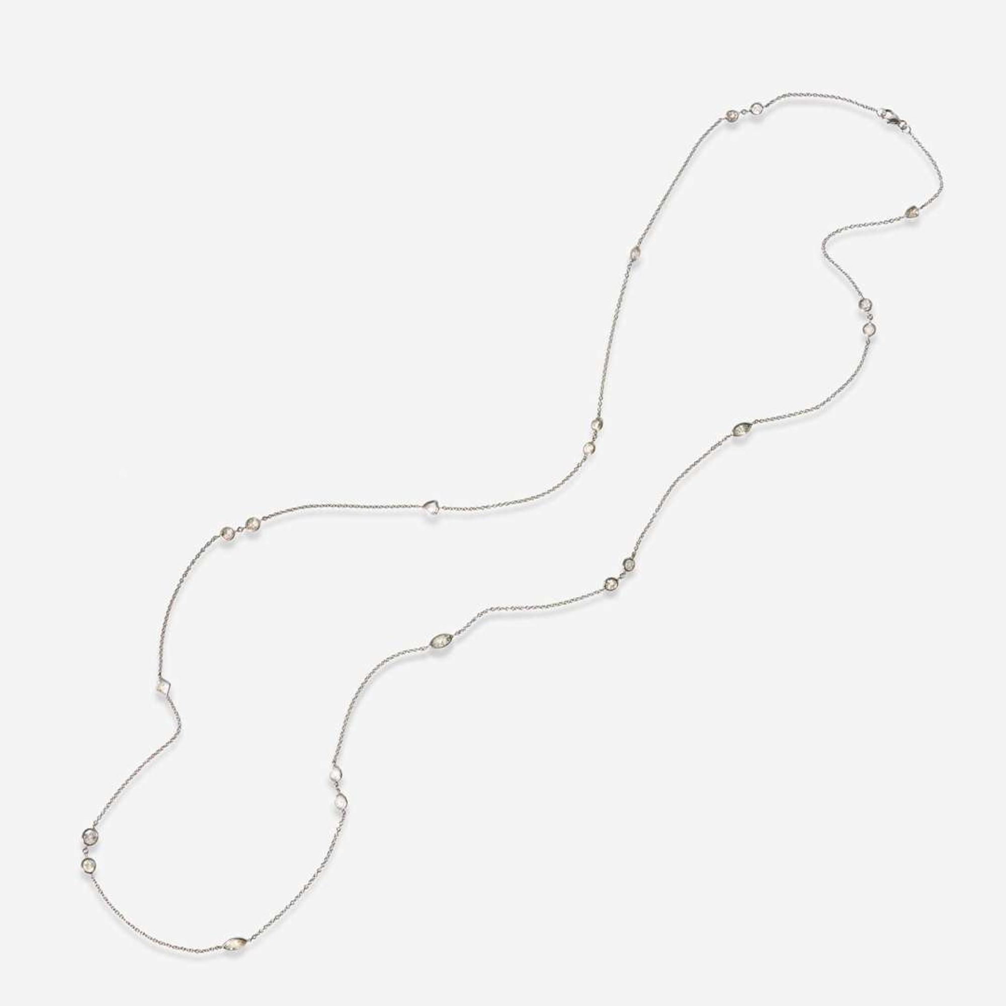 An 18K White Gold and Diamond Station Necklace