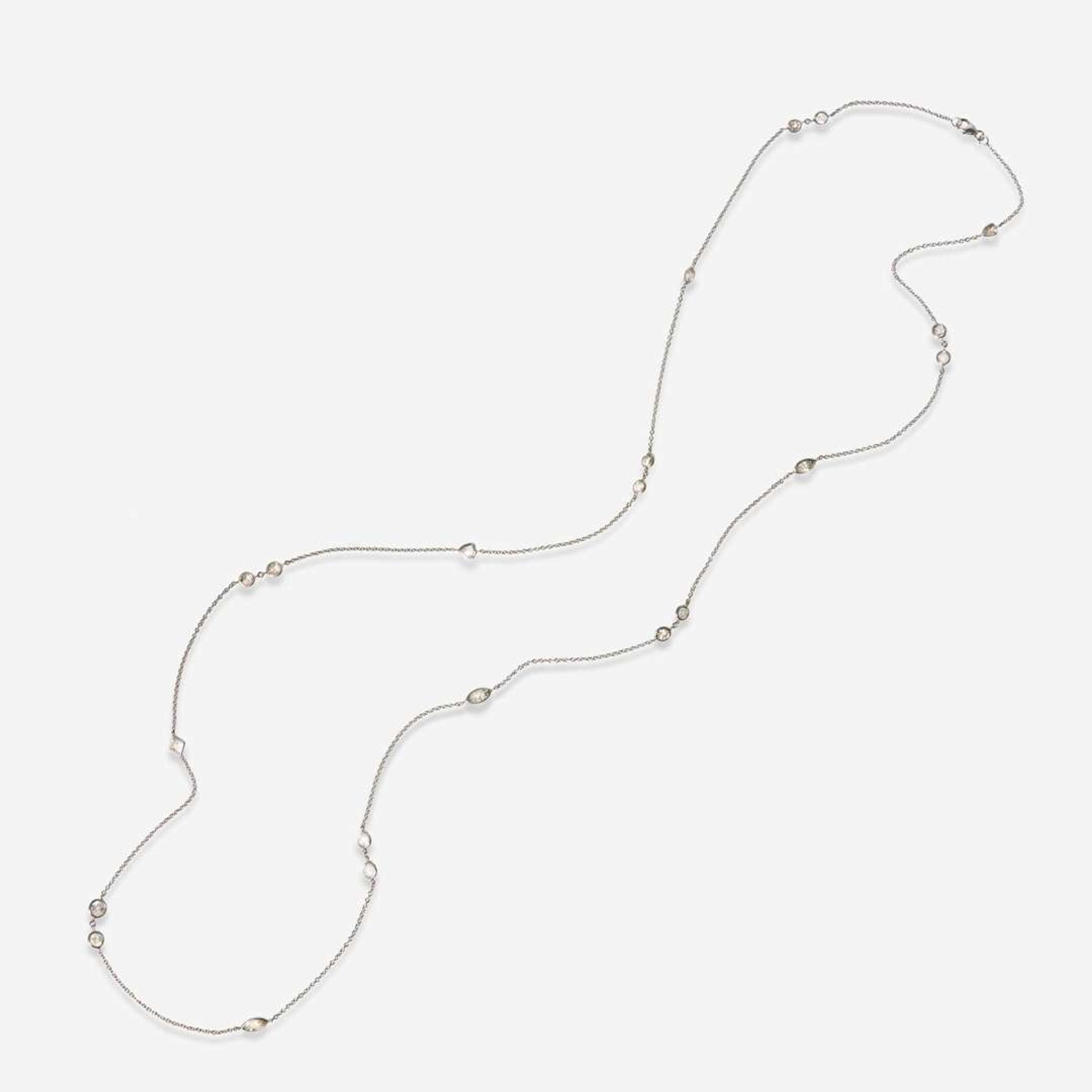 An 18K White Gold and Diamond Station Necklace