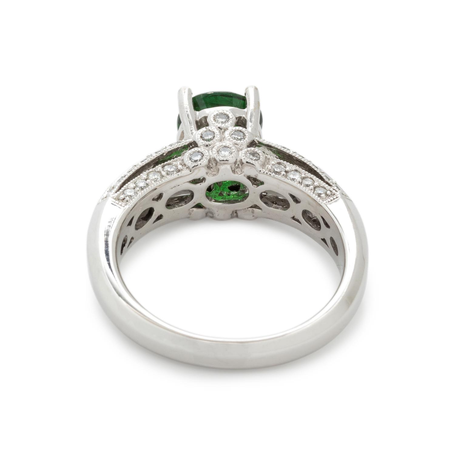 TSAVORITE GARNET AND DIAMOND RING