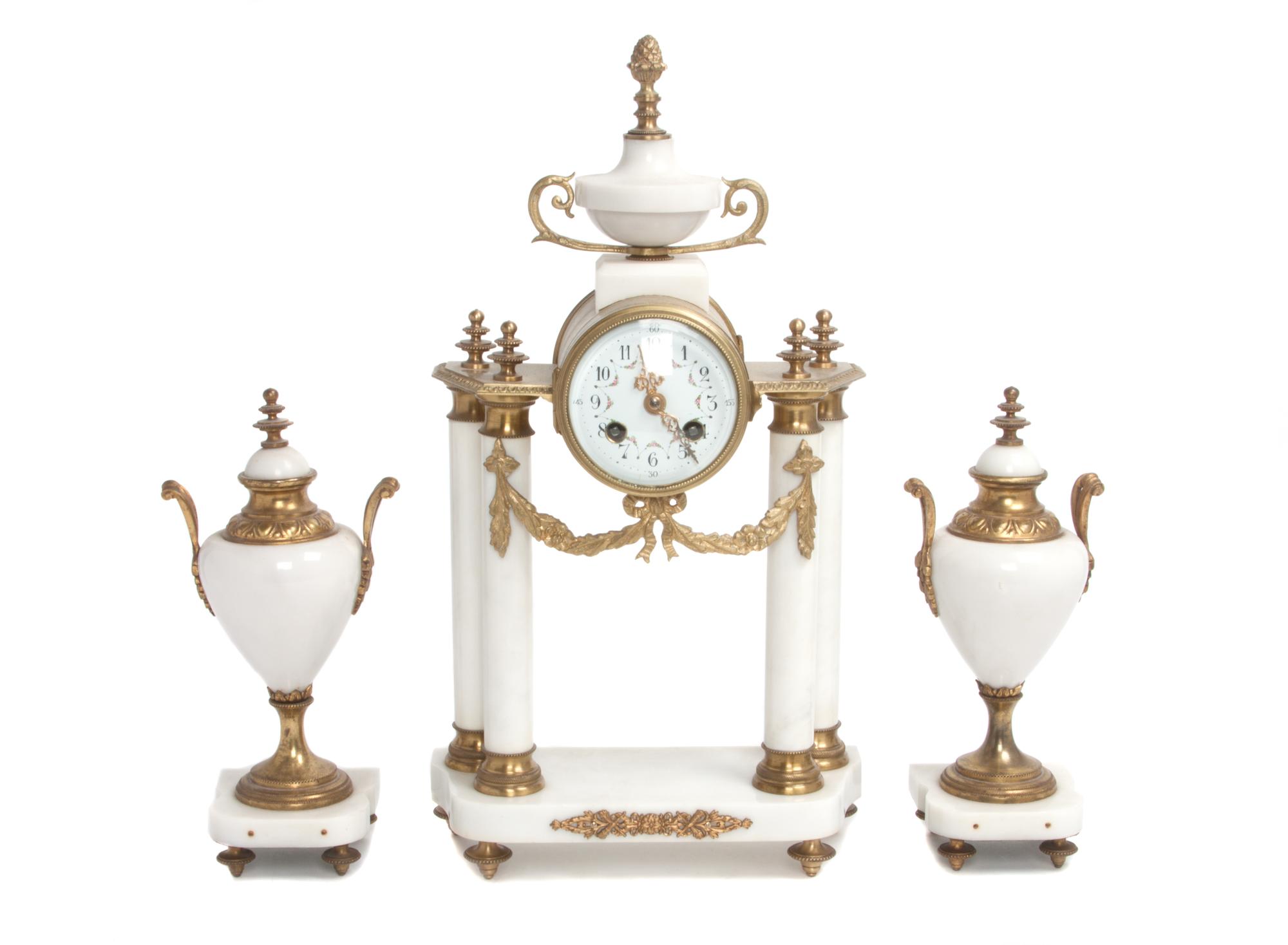 A Three-Piece Marble Clock Garniture Height 16 1/2 inches. — LATE 19TH/EARLY 20TH CENTURY