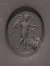 A Roman Amethyst Intaglio with Eros Stringing His Bow