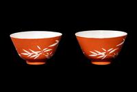A Pair of Chinese Coral Red Ground Porcelain 'Bamboo' Tea Bowls