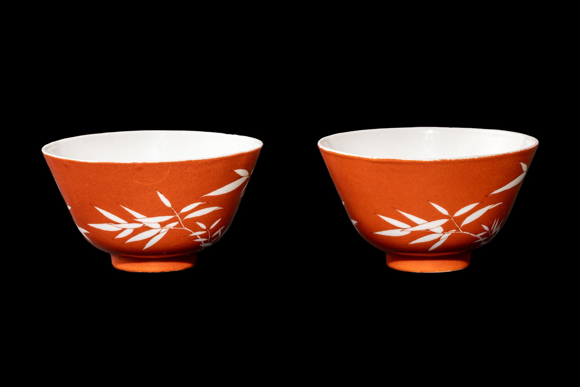 A Pair of Chinese Coral Red Ground Porcelain 'Bamboo' Tea Bowls