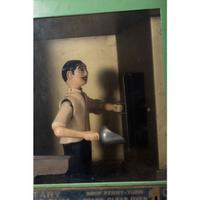 A Manikin Baker Boy Gum Vendor