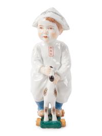 A Meissen Porcelain Figure of a Boy on a Pull Toy, by Konrad Hentschel