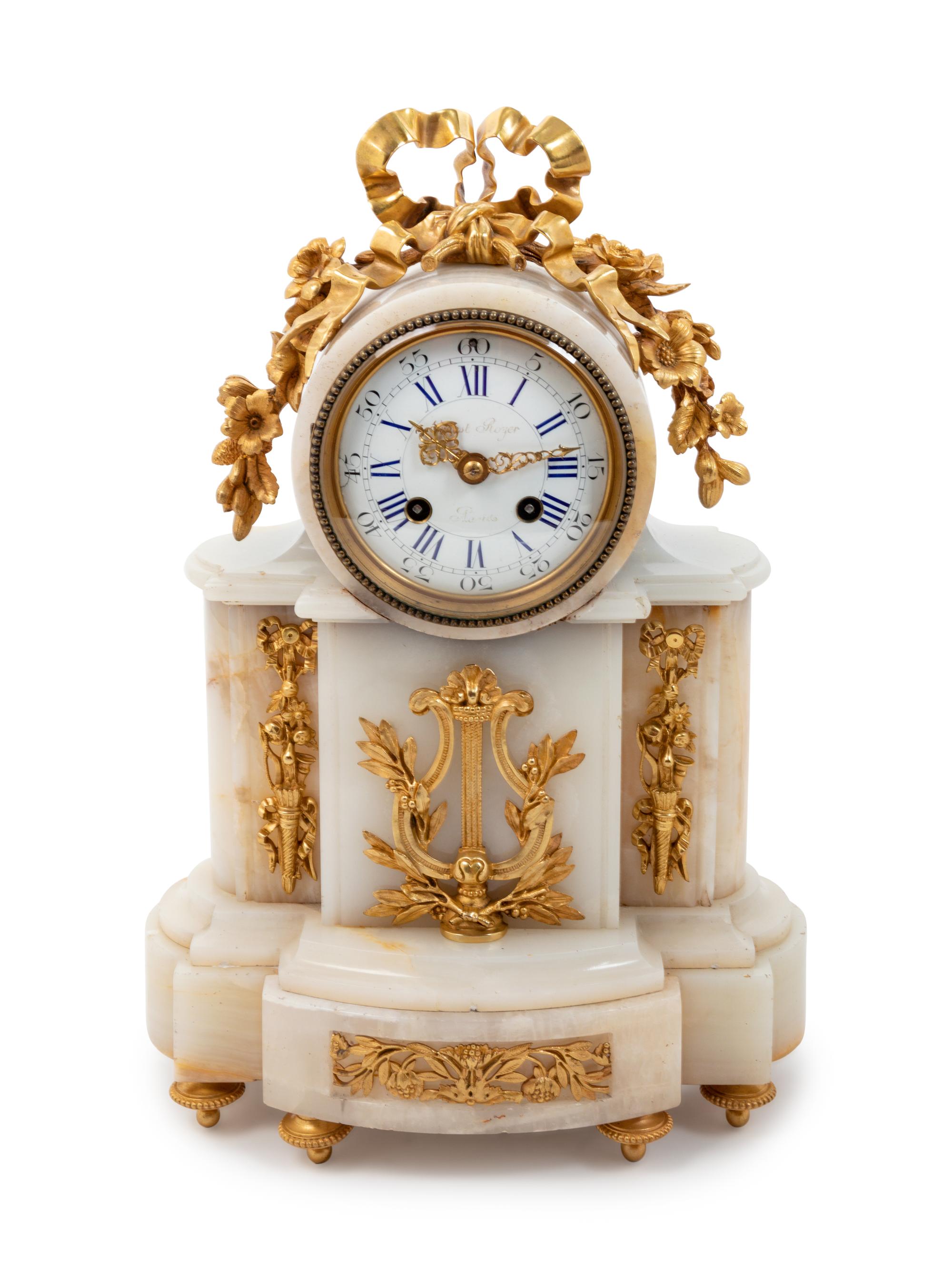 A Louis XVI Style Gilt Bronze Mounted Onyx Mantel Clock