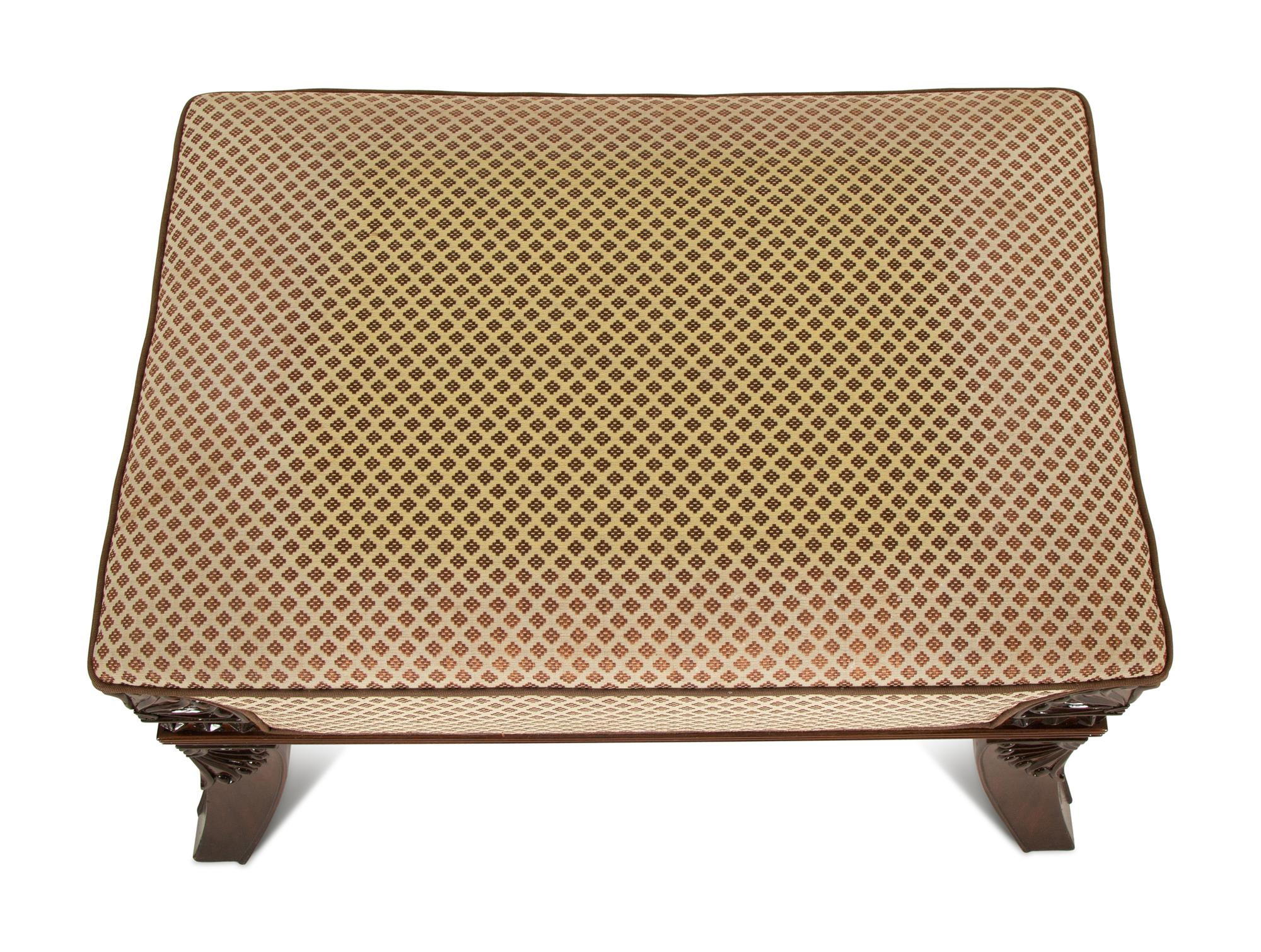 An Egyptian Revival Carved Mahogany Ottoman with Upholstered Seat — 20th Century