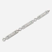 An Art Deco diamond, emerald, and platinum bracelet