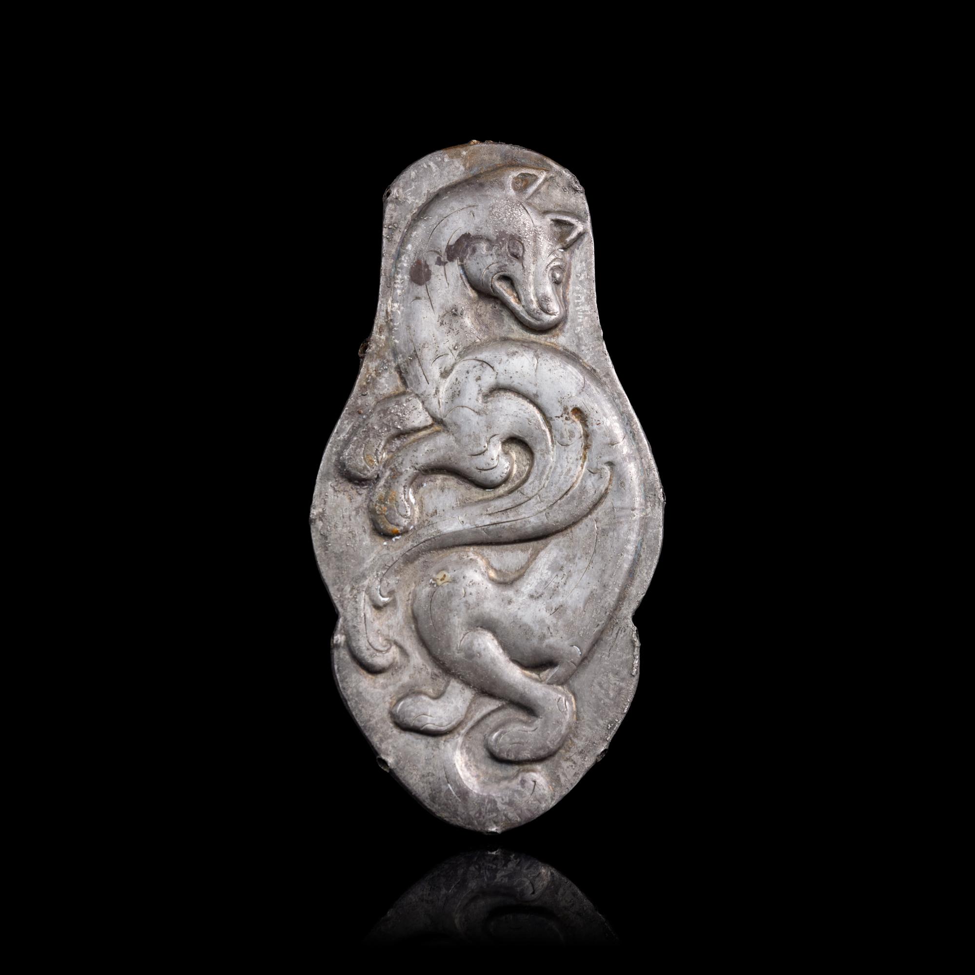 A Chinese Silver 'Winged Fox' Harness Ornament, Northeast China, Xianbei Tribe, Han-Jin Dynasty 汉-晉 鲜卑“飛狐”銀馬珂