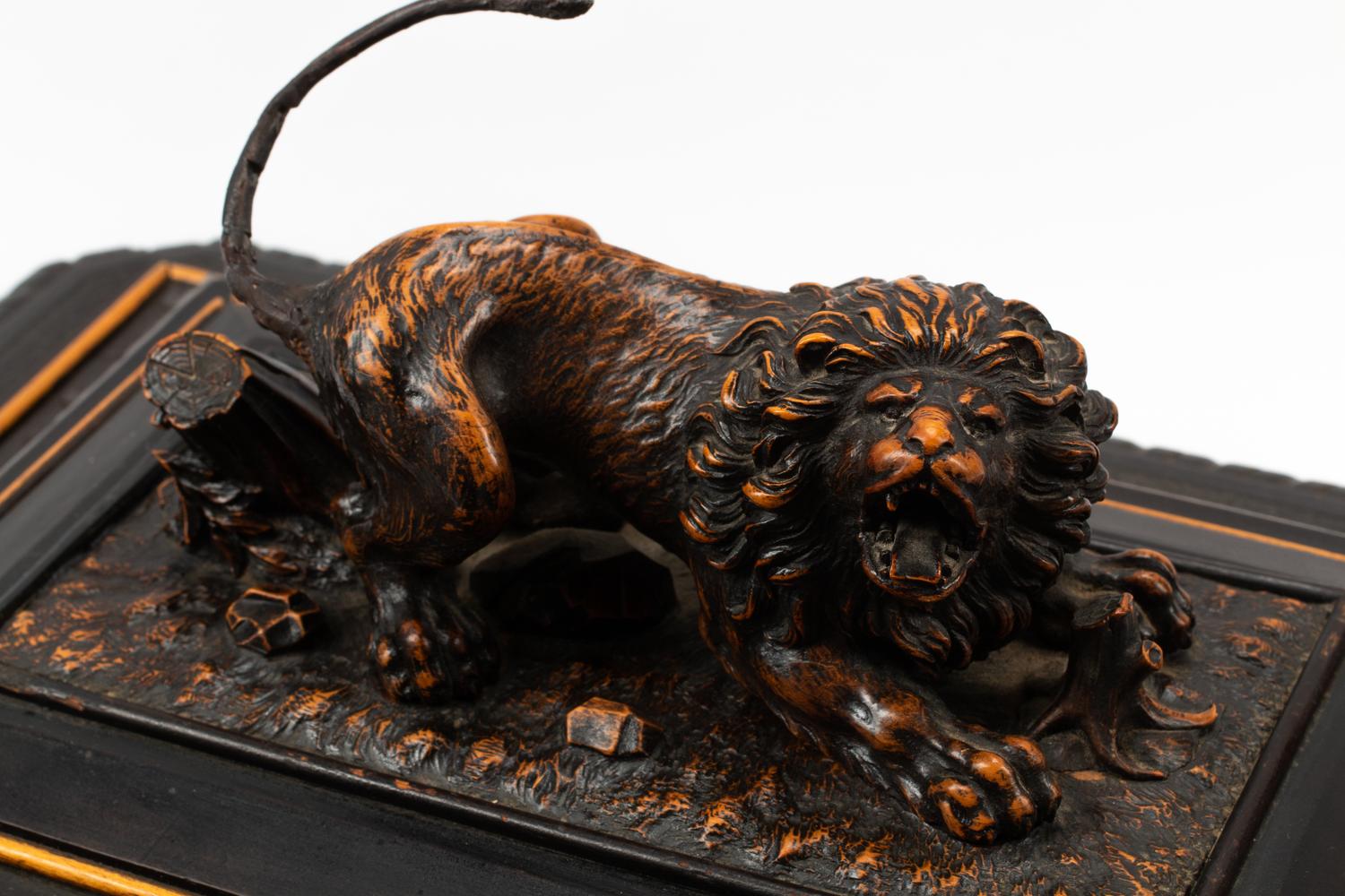 An Austrian Carved and Ebonized Wood Table Casket with a Lion